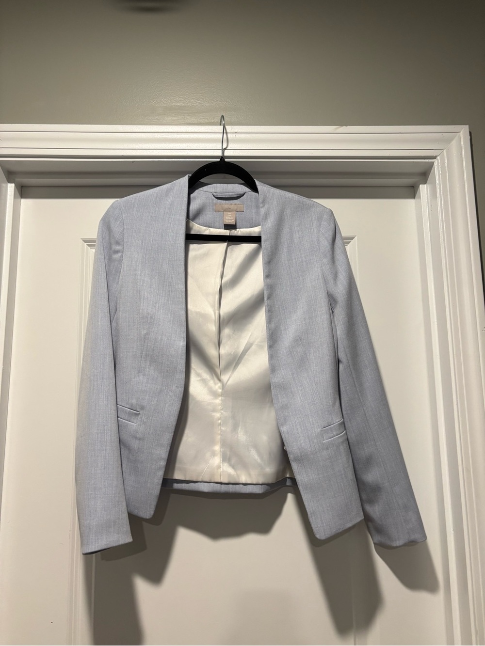 Woman’s Light Blue H&M Blazer with metal clasp size 0